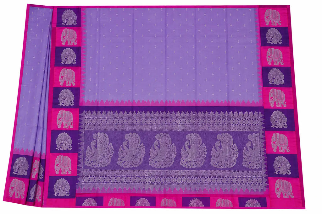 Lavender silk saree with patterned center stripe and magenta elephant border