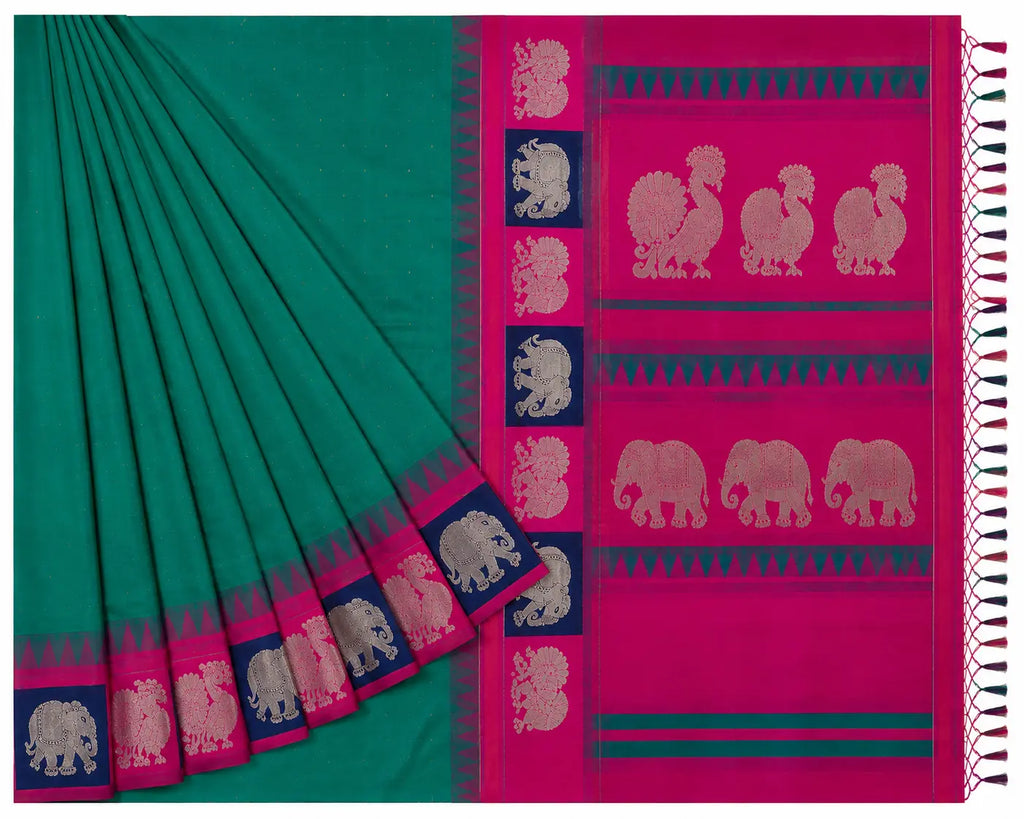Teal silk saree draped with pleats and magenta border featuring elephant motifs