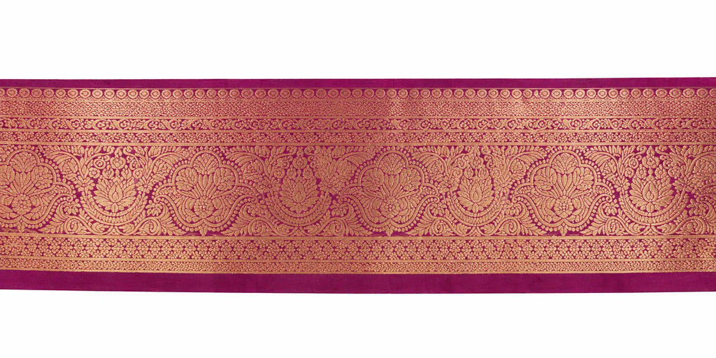 Saree border close-up in maroon with gold patterned band