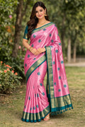 Pink pattu saree with teal border and small floral star motifs