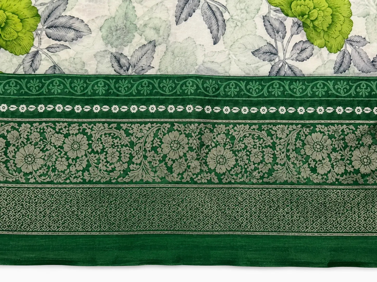 Green cotton saree with wide green border and floral leaf print