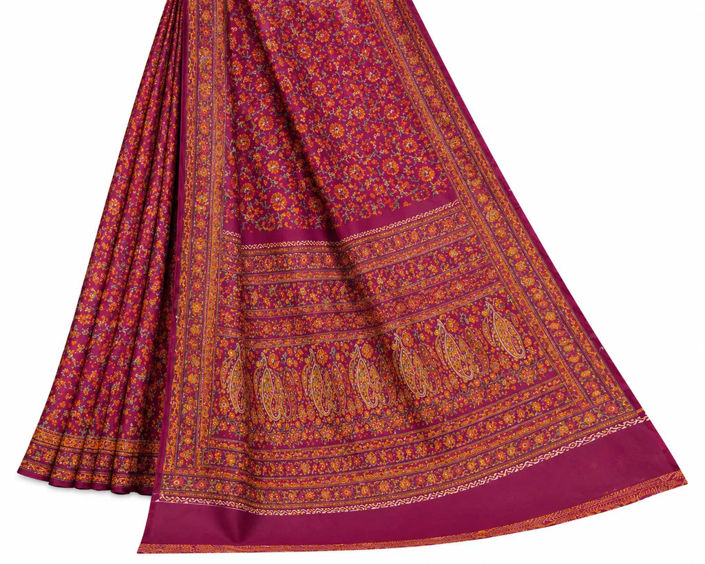 Maroon saree with ornate border and gold-toned floral banded pattern